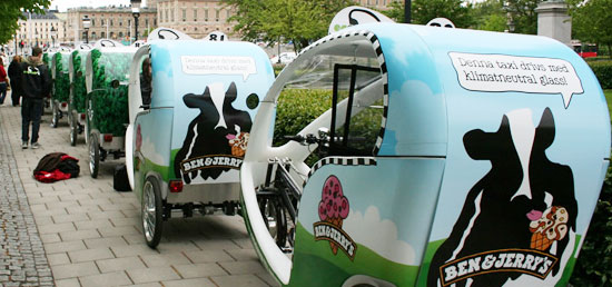 Compared to ordinary cabs these ecocabs have to rely on advertisements to keep them rolling.